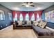 Home theatre area featuring projector, theatre decor, a ceiling fan, and comfortable seating at 4824 Sultana Sw Way, Atlanta, GA 30331