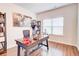 Bright office with built-in bookshelves, natural light, and elegant work space at 4824 Sultana Sw Way, Atlanta, GA 30331