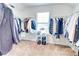 Spacious walk-in closet with ample hanging space and shoe storage at 4824 Sultana Sw Way, Atlanta, GA 30331