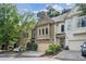 Beautiful townhome exterior showcasing multi-car garage, manicured landscaping, and welcoming entrance at 1028 Constitution Way, Cumming, GA 30040