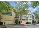 Charming townhomes featuring attached garages and beautiful curb appeal with mature trees at 1028 Constitution Way, Cumming, GA 30040