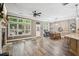 Open concept living area with fireplace, dining and outdoor access at 1028 Constitution Way, Cumming, GA 30040