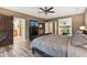 Luxurious main bedroom with ensuite, hardwood floors, barn door and large windows at 1028 Constitution Way, Cumming, GA 30040