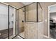 Contemporary shower with glass enclosure and tile surround near the closet at 1028 Constitution Way, Cumming, GA 30040