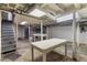 Exposed basement featuring stairs and two tables at 1080 Clifton Ne Rd, Atlanta, GA 30307