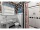 Classic bathroom with black and white tiling, pedestal sink, and shower at 1080 Clifton Ne Rd, Atlanta, GA 30307