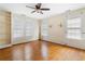 Bedroom with wood floors, light fixture, built in shelves and multiple windows at 1080 Clifton Ne Rd, Atlanta, GA 30307
