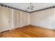 Bedroom showing hardwood flooring, trim, and multiple closets at 1080 Clifton Ne Rd, Atlanta, GA 30307