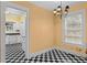 Cozy dining room adjacent to kitchen, features black and white checkered floors at 1080 Clifton Ne Rd, Atlanta, GA 30307