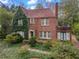 Charming brick home with mature landscaping and an inviting front entrance at 1080 Clifton Ne Rd, Atlanta, GA 30307