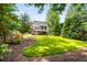 Beautiful backyard with lush lawn, landscaping, and views of the screened-in porch at 1338 Iverson Ne St, Atlanta, GA 30307