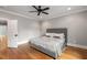 Bedroom with hardwood floors, a modern ceiling fan, and soft, gray color scheme at 1338 Iverson Ne St, Atlanta, GA 30307