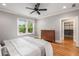 Bedroom with hardwood floors, dresser, natural light, closet and a modern ceiling fan at 1338 Iverson Ne St, Atlanta, GA 30307