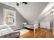 Bedroom with wood floors, a bright window, and a vaulted ceiling at 1338 Iverson Ne St, Atlanta, GA 30307