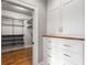 Walk-in closet with custom shelving, drawers and ample storage space at 1338 Iverson Ne St, Atlanta, GA 30307