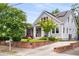 Side view of a home with a well-manicured lawn, brick retaining wall, and solar panels at 1338 Iverson Ne St, Atlanta, GA 30307