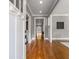 Inviting foyer featuring gleaming hardwood floors, neutral paint, and an open layout at 1338 Iverson Ne St, Atlanta, GA 30307