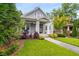 Charming home featuring a covered porch, well-manicured lawn, mature trees, and lovely landscaping at 1338 Iverson Ne St, Atlanta, GA 30307