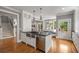 Gourmet kitchen with a stainless farm sink, hardwood floors, and an eat in dining area with bench seating at 1338 Iverson Ne St, Atlanta, GA 30307