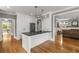 Gourmet kitchen features white cabinets, black counters, stainless appliances and hardwood floors at 1338 Iverson Ne St, Atlanta, GA 30307