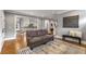 Bright living room with hardwood floors, comfortable seating, and an open view to the kitchen at 1338 Iverson Ne St, Atlanta, GA 30307