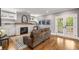 Cozy living room with hardwood floors, fireplace, built-ins, and lots of natural light at 1338 Iverson Ne St, Atlanta, GA 30307