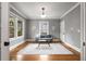 Cozy living room featuring hardwood floors, neutral paint, large windows, and ample natural light at 1338 Iverson Ne St, Atlanta, GA 30307