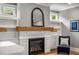 Living room featuring a fireplace, built-in bookshelves, and a comfortable chair at 1338 Iverson Ne St, Atlanta, GA 30307