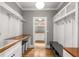 Mudroom featuring custom storage, a bench, hooks, and a sink area at 1338 Iverson Ne St, Atlanta, GA 30307