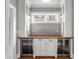 Pantry features ample storage, custom cabinets, wood countertop, and two wine coolers at 1338 Iverson Ne St, Atlanta, GA 30307