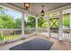 Covered porch features stylish lanterns, wooden floors, and outdoor access at 1338 Iverson Ne St, Atlanta, GA 30307
