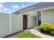 Private side yard with a wooden gate and low-maintenance landscaping, offering a cozy outdoor retreat at 418 Thaxton Ln, Woodstock, GA 30188