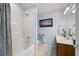 Bright bathroom featuring a shower and tub combination with modern fixtures and decor at 418 Thaxton Ln, Woodstock, GA 30188