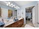 Spacious bathroom with double vanity, walk-in shower, and doorway to a walk-in closet at 418 Thaxton Ln, Woodstock, GA 30188