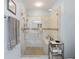 Tiled shower with glass door, rain shower head, built-in bench, and toiletry storage at 418 Thaxton Ln, Woodstock, GA 30188