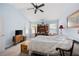 Bedroom featuring a bed, ceiling fan, windows with blinds, carpeting, and desk at 418 Thaxton Ln, Woodstock, GA 30188