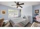 Comfortable bedroom with carpet, a ceiling fan, natural light, and quaint furnishings at 418 Thaxton Ln, Woodstock, GA 30188