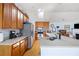 Bright kitchen featuring hardwood floors, an island with seating, and plenty of counter space and storage at 418 Thaxton Ln, Woodstock, GA 30188