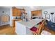 Spacious kitchen with hardwood floors, a kitchen island with seating, and modern appliances at 418 Thaxton Ln, Woodstock, GA 30188