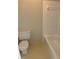 Bathroom featuring a toilet and a shower with square white tiles at 4525 N Landing Dr, Marietta, GA 30066