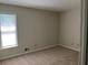 Bedroom with neutral carpet, window, and paint, ready for your personal touch at 4525 N Landing Dr, Marietta, GA 30066
