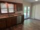 Modern eat in kitchen with stainless steel dishwasher, wood cabinets, and a view of the back yard at 4525 N Landing Dr, Marietta, GA 30066
