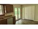 Cozy kitchen featuring granite countertops, wood cabinets, stainless steel appliances, and wood floors at 4525 N Landing Dr, Marietta, GA 30066