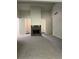 Large living room with stone fireplace, neutral carpet, and an open floor plan at 4525 N Landing Dr, Marietta, GA 30066