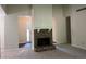 Open-concept living room with a fireplace and neutral paint, leading to the front entrance at 4525 N Landing Dr, Marietta, GA 30066