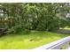 Lush, green backyard with mature trees providing ample shade and privacy at 936 Tyrell Dr, Austell, GA 30106