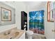 Quaint bathroom featuring a vanity with an integrated sink and a shower with decorative curtain at 936 Tyrell Dr, Austell, GA 30106
