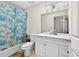 Clean bathroom featuring a shower-tub combination and a white vanity with ample storage space at 936 Tyrell Dr, Austell, GA 30106