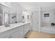 Large bathroom with dual sinks, soaking tub, and plenty of counter space at 936 Tyrell Dr, Austell, GA 30106
