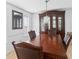 Formal dining room showcasing a large wooden table with seating for four and a china cabinet at 936 Tyrell Dr, Austell, GA 30106